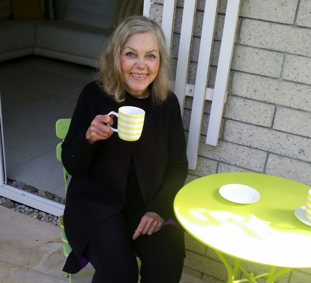 Sandra Petersen enjoying a coffee outside