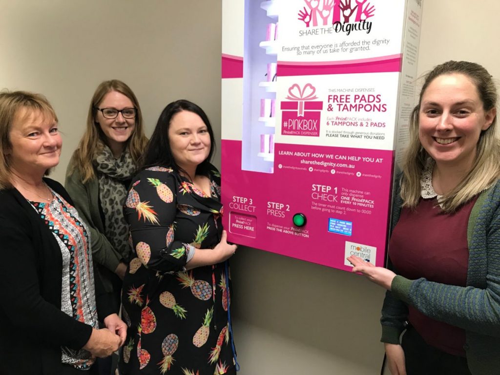 Anglicare team members with the new Pinkbox vending machine