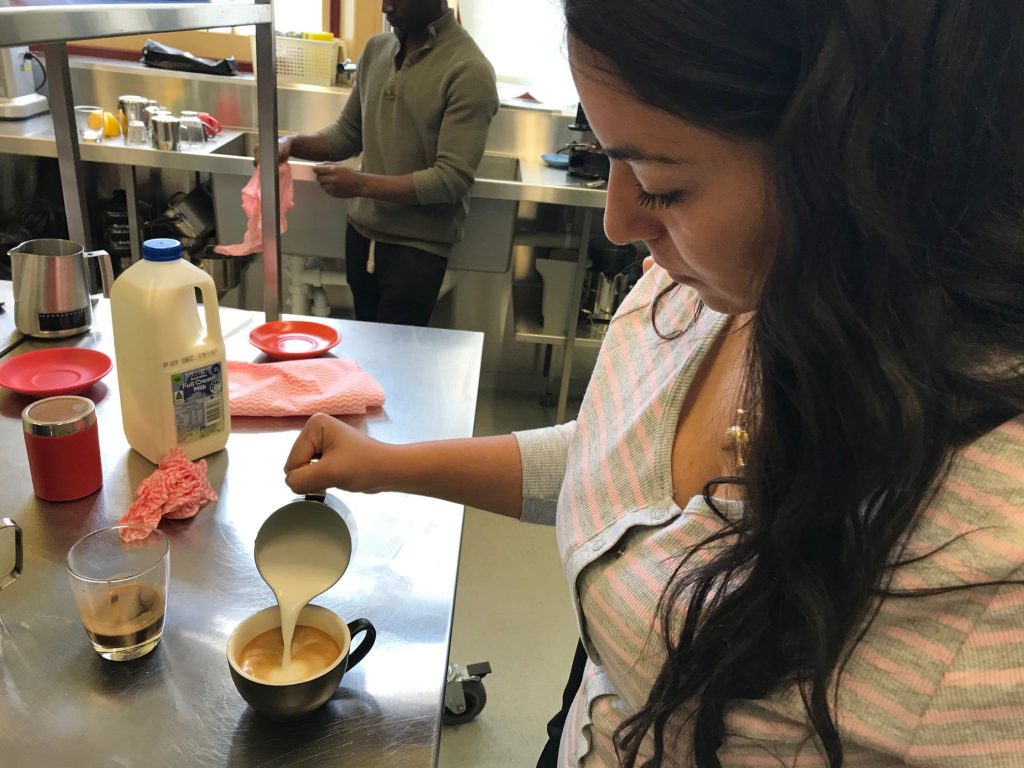 Student at Anglicare supported youth accommodation doing a coffee making essentials course.