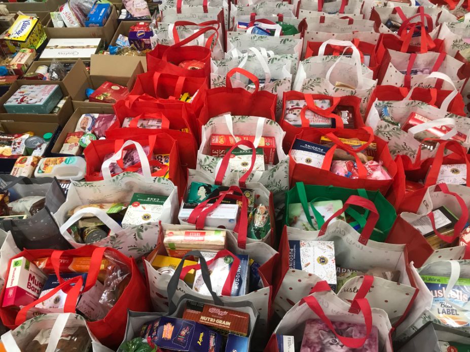 Bags of food donated during the Christmas Appeal are thoughtfully distributed to people in need.