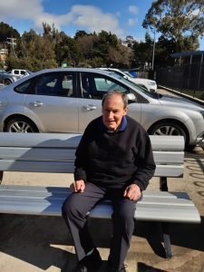 Client is happy spending some time sitting outside in the sun beside the river