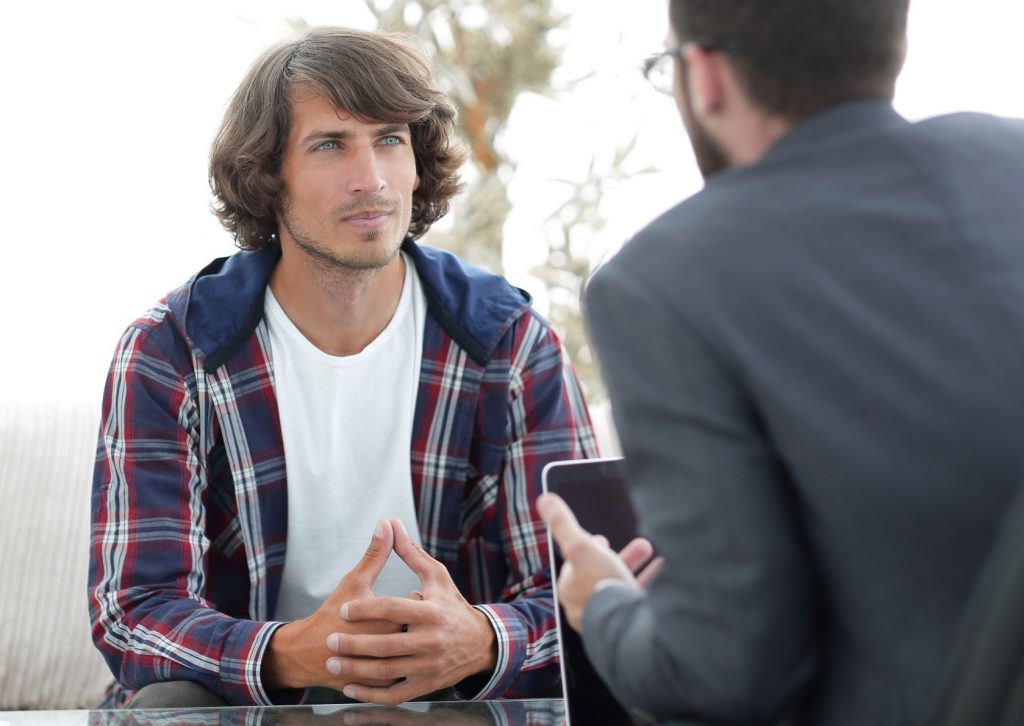 two people talking as if in a counselling session