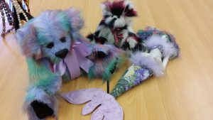 a collection of handmade dolls made by one of the artists
