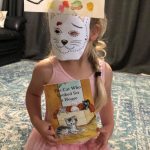 Child with a handmade facemask that looks like a cat