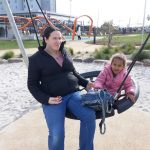 adult and child on a swing