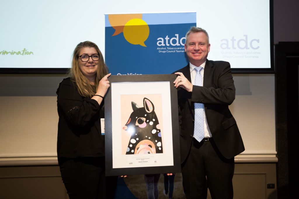 Cherie, a health and wellbeing addictions practitioner being presented with the Individual Award for Excellence by the Minister for Health Hon Jeremy Rockliff.