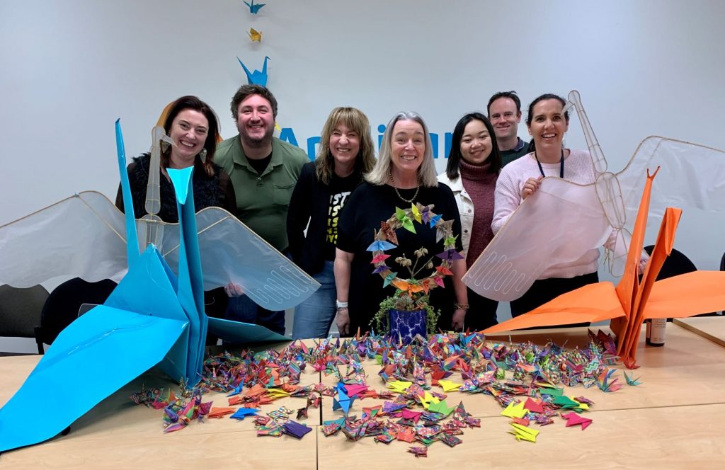 photo of anglicare team with a bunch of cranes including some very large ones