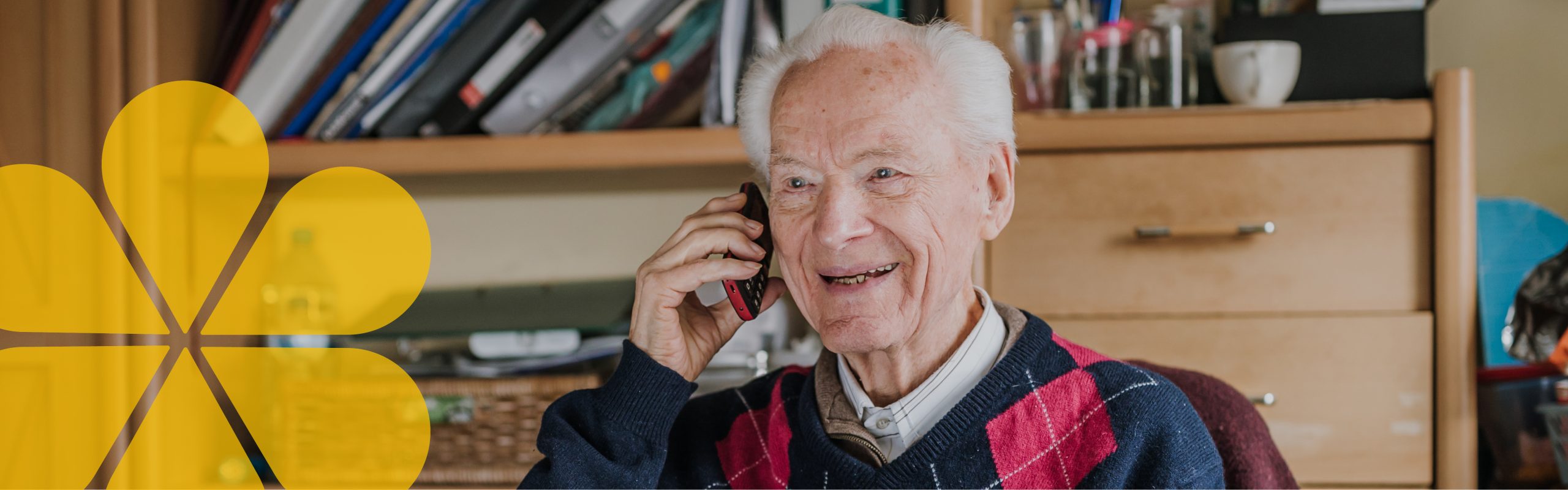 Older person talking on the phone and smiling