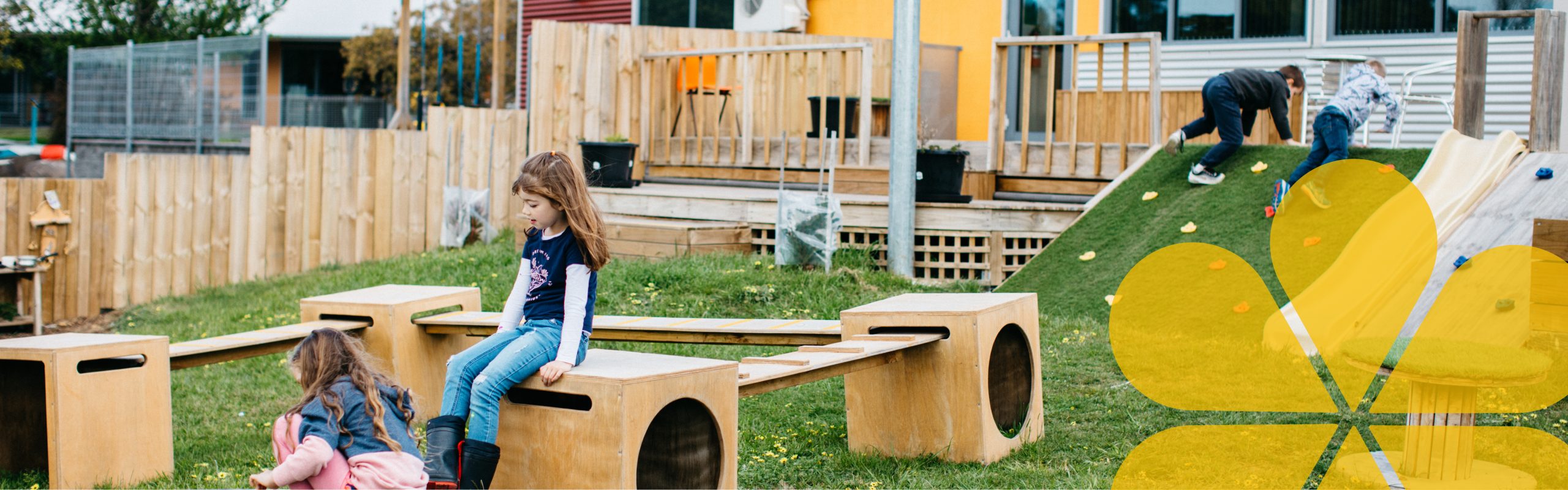 Young children playing in an outdoor playground.