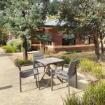 Lovely garden area oustide with table and chairs to enjoy the sun