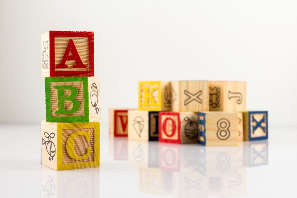 Wooden blocks with the letters A B and C on them.