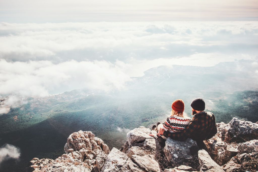 Find healthy activities to help you avoid gambling. Pictured: riends sitting on a mountain top overlooking Hobart.