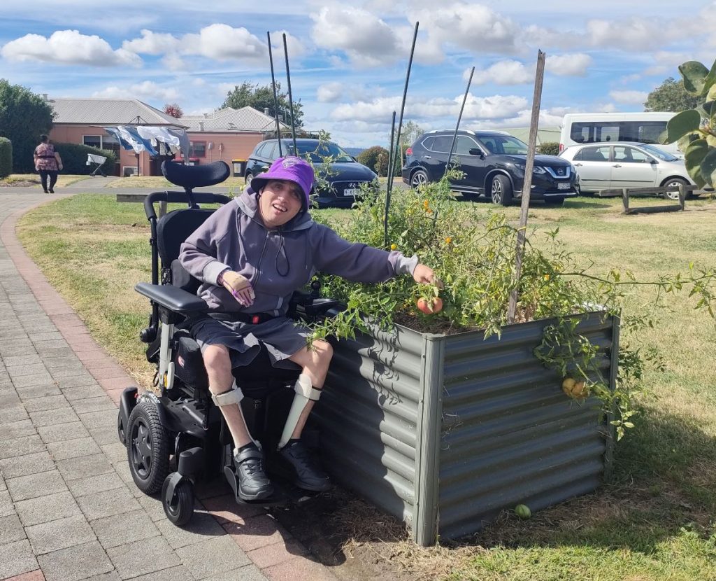 Verdun, pictured here with Support Worker Georgie Booker, will star in a new video that tells the story of our Acquired Injury Support Services. Ver